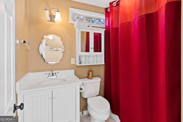 bathroom featuring vanity and toilet