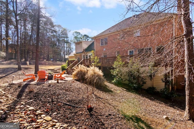 view of yard with a wooden deck