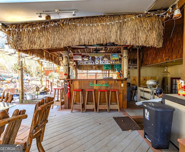 wooden deck featuring a bar