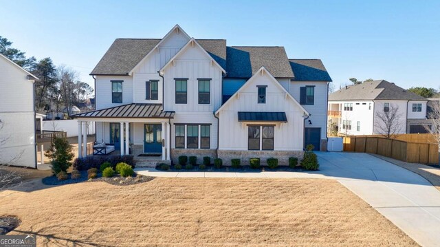 modern farmhouse style home with covered porch