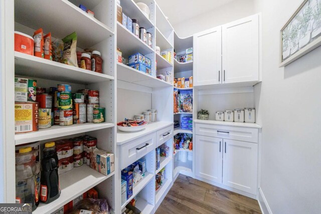 kitchen featuring sink, tasteful backsplash, ornamental molding, dishwasher, and white cabinets