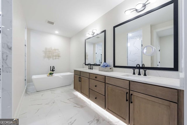 bathroom featuring vanity and a tub