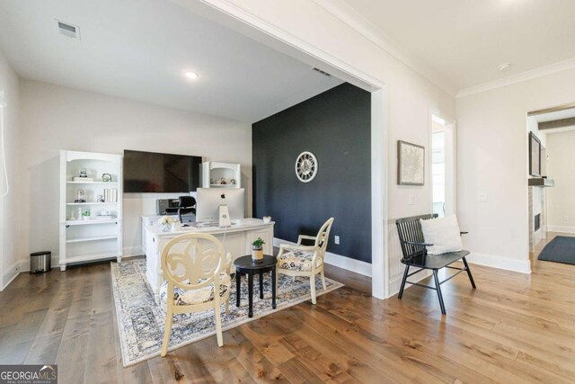 hall featuring crown molding and hardwood / wood-style floors