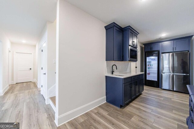 bathroom featuring walk in shower, vanity, and toilet