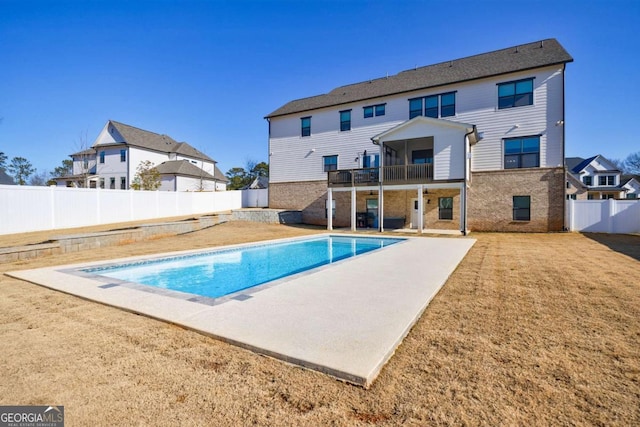 view of pool featuring a lawn and a patio area