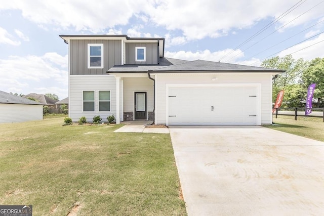 view of front facade with a garage and a front lawn