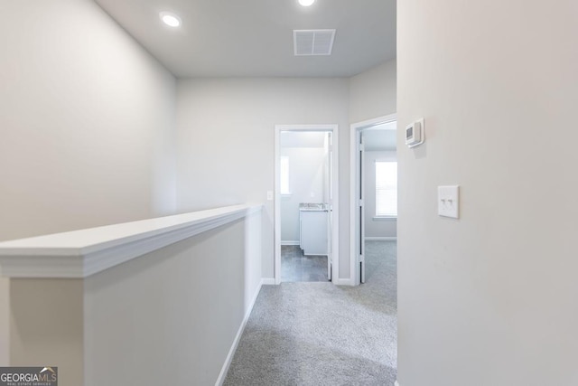 corridor with carpet floors