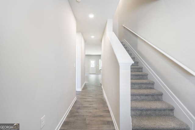 stairway with wood-type flooring