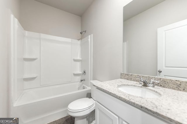 full bathroom with washtub / shower combination, vanity, and toilet