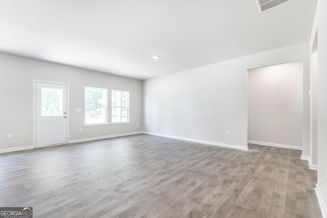 unfurnished living room with light hardwood / wood-style floors