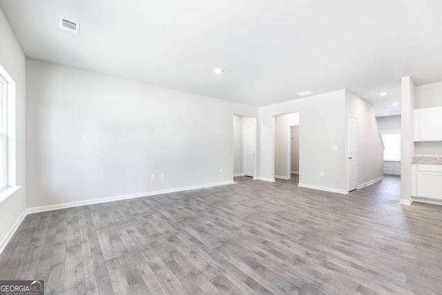 unfurnished living room featuring light wood-type flooring