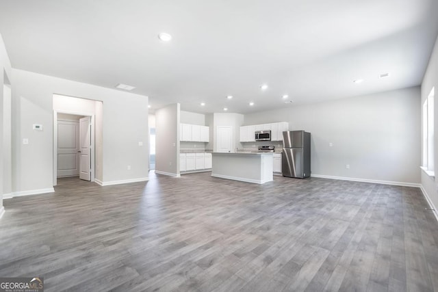 unfurnished living room with light hardwood / wood-style floors