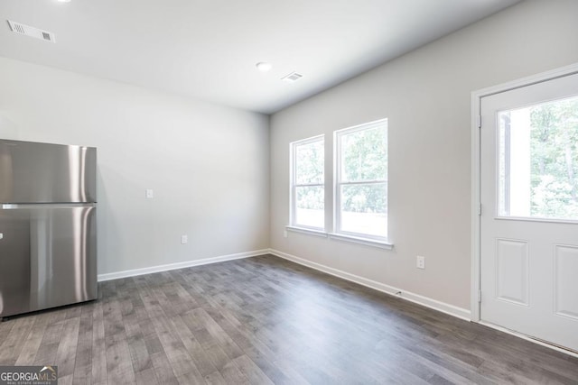 unfurnished dining area featuring hardwood / wood-style floors and a wealth of natural light