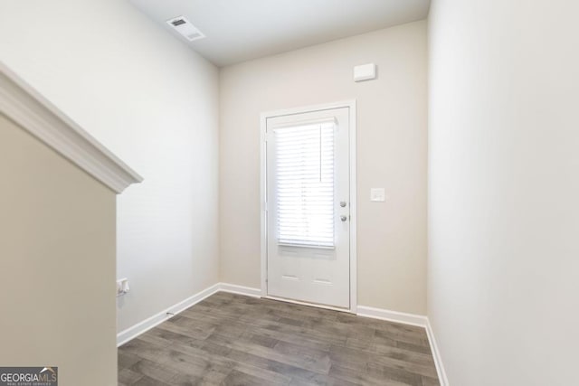 doorway with hardwood / wood-style floors