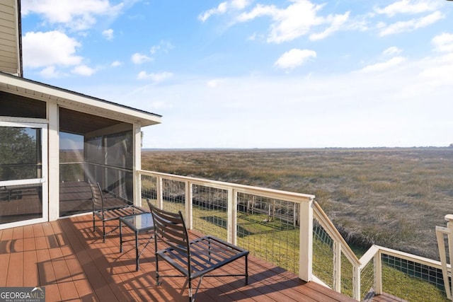 wooden deck with a sunroom