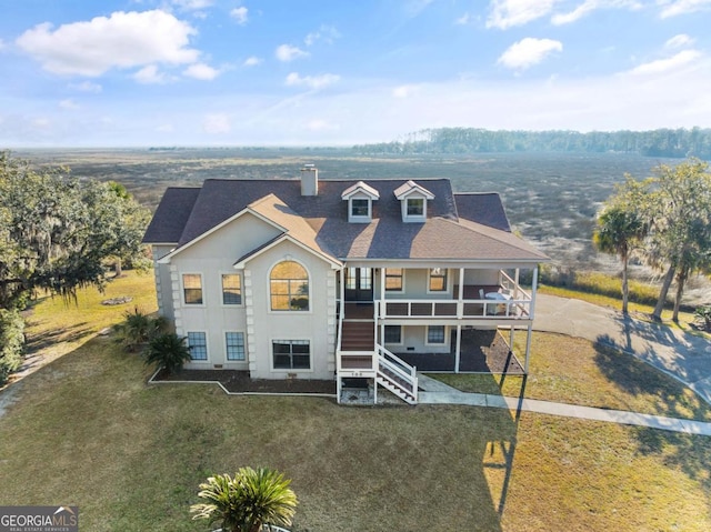 view of front of home with a front lawn