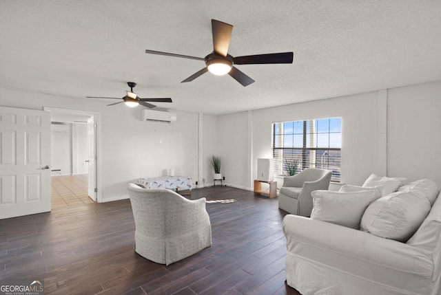 living room featuring a wall unit AC, ceiling fan, dark wood-type flooring, and a textured ceiling