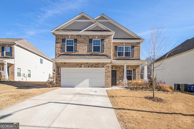 craftsman-style house featuring a garage and cooling unit