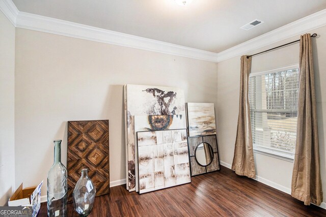 unfurnished living room featuring ornamental molding, ceiling fan, and dark hardwood / wood-style floors