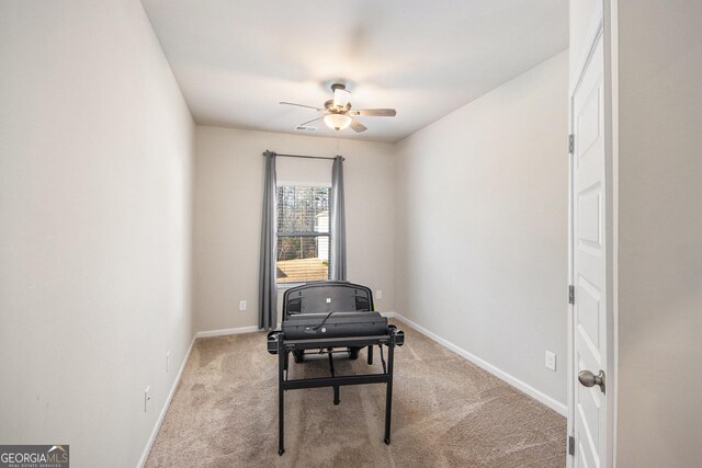 misc room featuring ceiling fan and light carpet