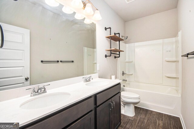 full bathroom with shower / bath combination, toilet, vanity, and hardwood / wood-style flooring