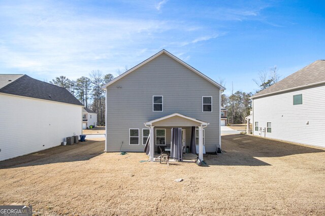 back of property featuring central AC unit