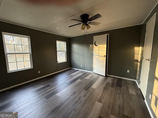 interior space featuring a textured ceiling, ceiling fan, and dark hardwood / wood-style floors