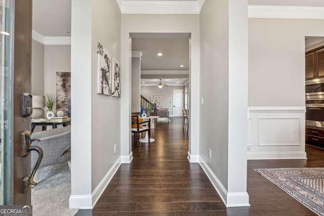 corridor featuring dark hardwood / wood-style flooring and ornamental molding