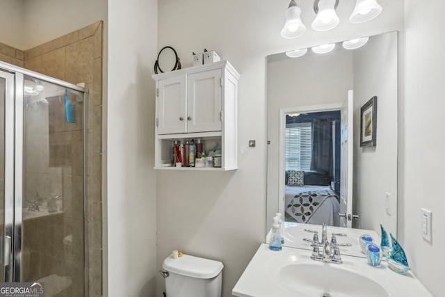 bathroom with vanity, toilet, and walk in shower