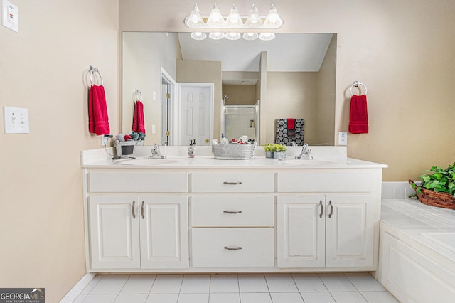 bathroom with tile patterned floors, vanity, and an enclosed shower