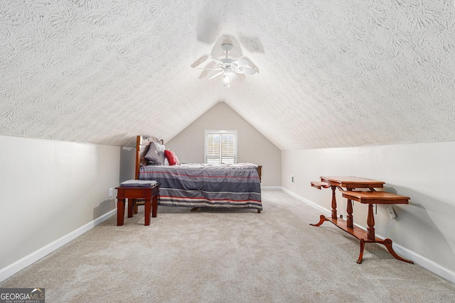 carpeted bedroom with ceiling fan and lofted ceiling