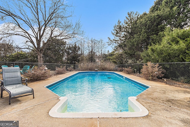 view of swimming pool featuring a patio