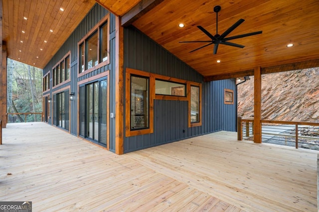 wooden deck featuring ceiling fan