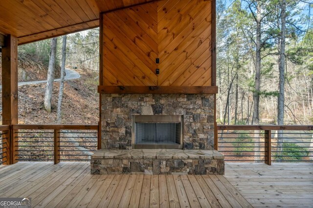 wooden terrace featuring a water view