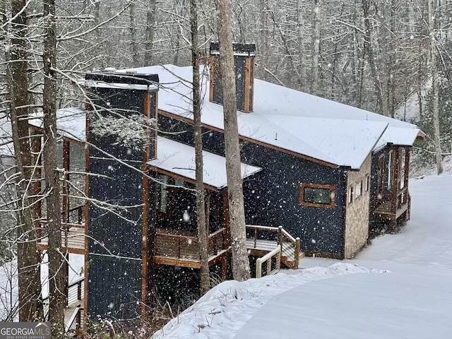 view of snow covered property