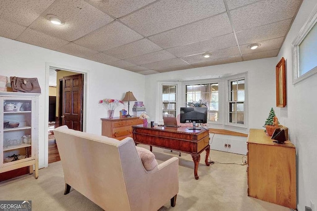 home office with a paneled ceiling