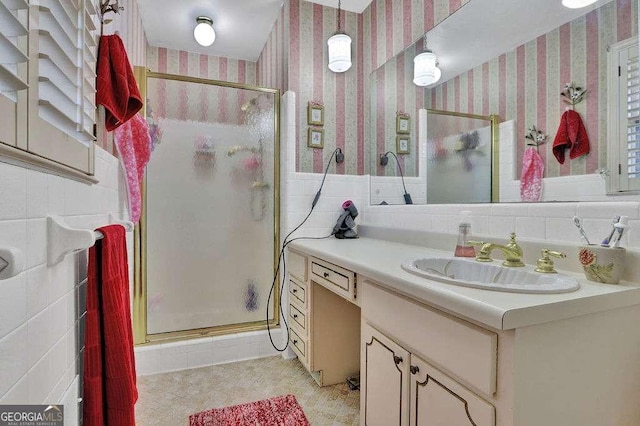 bathroom featuring vanity and an enclosed shower