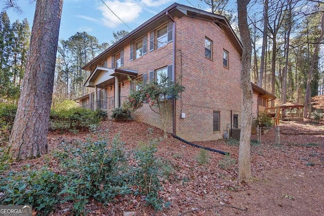 view of side of property featuring a gazebo