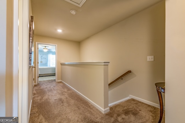 hallway featuring light carpet