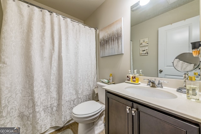 bathroom with vanity and toilet