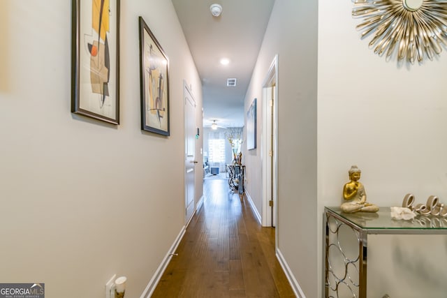 hallway with dark wood-type flooring