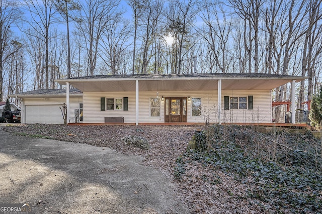 view of front of property with a porch and a garage