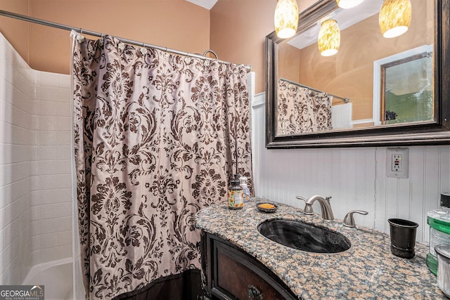 bathroom featuring vanity and shower / bath combo with shower curtain