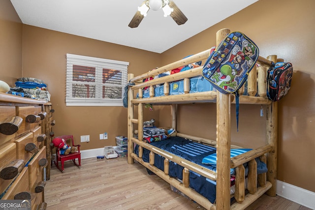 bedroom with hardwood / wood-style flooring and ceiling fan