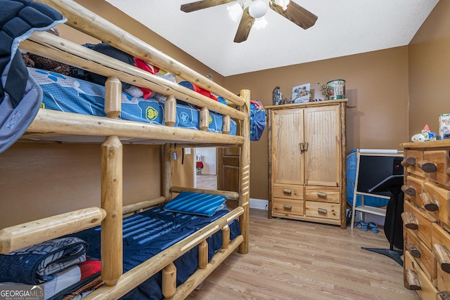 bedroom with ceiling fan and light wood-type flooring