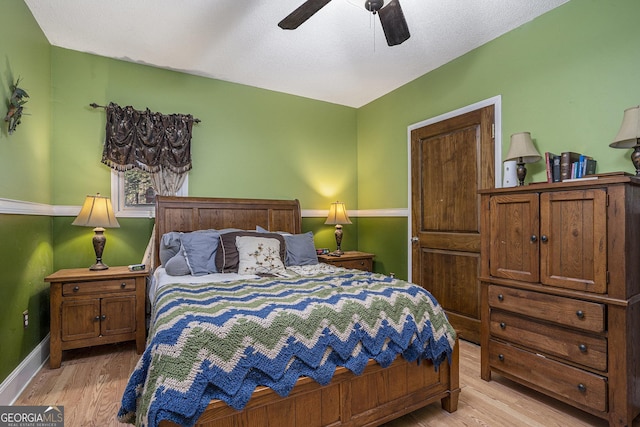 bedroom featuring ceiling fan and light wood-type flooring