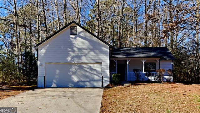 view of front facade with a porch and a garage