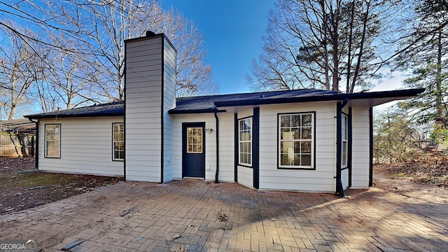 back of house with a patio