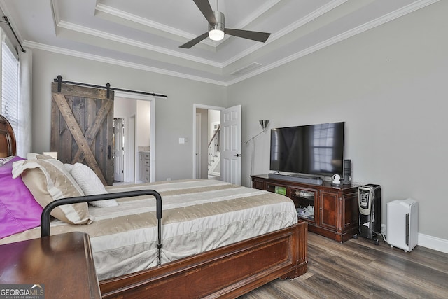 bedroom featuring ceiling fan, crown molding, a barn door, and wood-type flooring