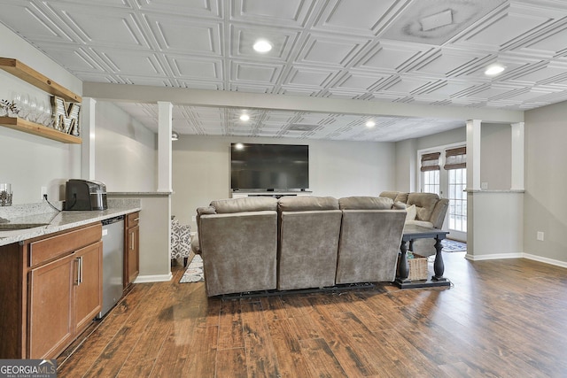 living room with sink and dark hardwood / wood-style floors